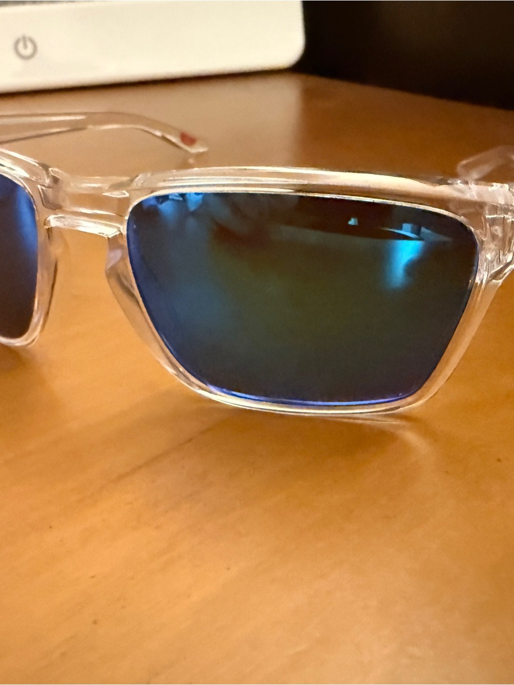 Oakley Clear Frame Sunglasses with Blue Mirrored Lenses
